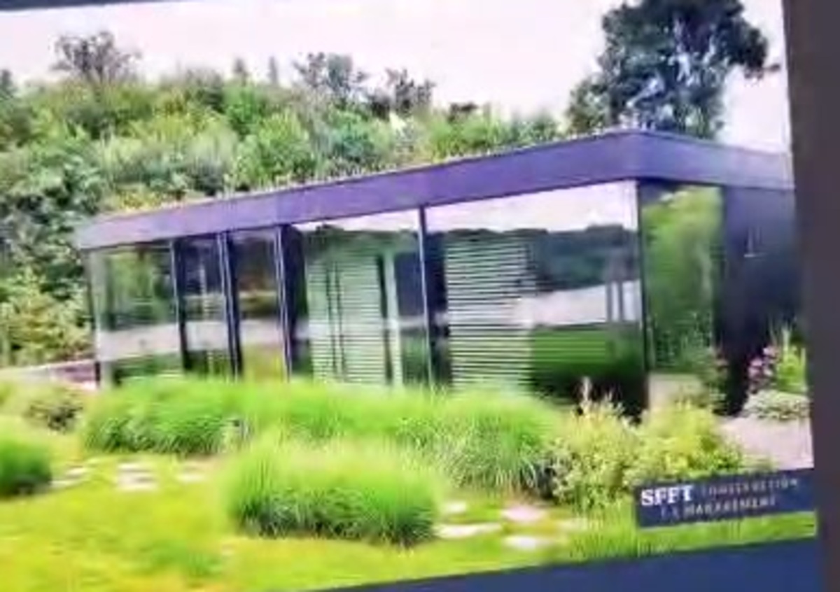 Glass pavilion by the water